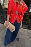 Red Mystical Cardigan with a structured collar, jacquard motifs and white blanket stitching.
