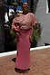 Pink and Red Jacquard Tilly Dress with gold metallic dots and off-the-shoulder neckline in a sunny setting.