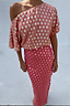 Pink and Red Jacquard Tilly Dress featuring a gold pattern and an off-the-shoulder neckline.