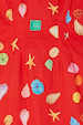 Red Shell Ioana Mini Dress detail featuring a multicoloured shell and starfish print on a red cotton-linen base.