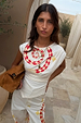 Snake Asymmetric Top in white with a red checkered snake print, star motifs and gathered waist detailing.
