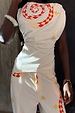 Snake Asymmetric Top with red snake print and star motifs, featuring a gathered waist and matching trousers.