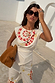 White cotton Snake Asymmetric Top with red snake print, star motifs and gathered waist, styled as a co-ord.