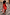 Thumbnail for Tomato Mini Sophie Dress in red with a draped back and detachable scarf ties, shown on stone steps.