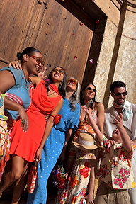 Red Tomato Mini Sophie Dress with a cowl neck, styled in a joyful community group setting.