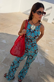 Red Mesh Tote Bag with leather straps and a printed pouch, styled on a model for an everyday vacation look.