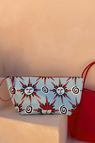 Light blue pouch featuring a sun and swirl print, included with the Red Mesh Tote Bag designed in London.