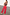 Thumbnail for Red Denim Scallop Jeans with a wide-leg cut and scalloped pockets, styled with a brown vest and patterned neck scarf.