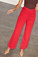 Red Denim Scallop Jeans with a wide leg and scalloped pocket detail, paired with pointed heels.