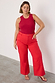 Red Denim Scallop Jeans with a wide-leg cut and scalloped pockets, styled with a dark red ribbed tank top.