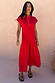 Red Darcy Cotton Midi Dress with a dropped waist and cap sleeves, designed in London and shown on a model.