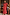 Thumbnail for Red Bandana Remi Dress with leopard sleeves and a ruffled neckline, shown on a model for inclusive sizing.
