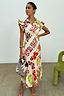 Thumbnail for Fruit Stamps Remi midi dress in white cotton-linen with ruffle sleeves, a buttoned collar and colourful fruit motifs.