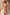 Thumbnail for Dolce Vita Remi Dress in a sunset-toned patchwork print with a high neck and ruffle sleeves against a stone wall.