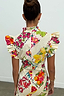 Thumbnail for Fruit Stamps Remi Dress in cream cotton-linen featuring a multi-coloured fruit print and tiered ruffle sleeves.