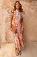 Dolce Vita Remi Dress in a sunset-toned patchwork print with a high neck and statement ruffle sleeves.