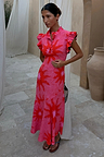 Pink Soleil Remi Dress featuring red sun motifs, pleated frill details and an asymmetrical skirt.