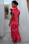 Pink Soleil Remi Dress with red sun motifs, pleated frill sleeves with leopard lining and an asymmetrical skirt.