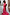 Thumbnail for Pink Soleil Remi Dress with red sun motifs and leopard lining on pleated frill sleeves, shown on a smiling woman.