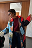 Thumbnail for Multi-wear longline Navy Abstract Coat in a quilted design with an iconic leopard print reverse, shown on a model.