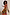 Thumbnail for Rio Mesh Dress with bold fruit motifs and colour blocks on stretch mesh, worn by a model on a white staircase.