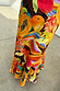 Rio A-Symmetric Skirt in a tropical fruit print jersey, featuring an asymmetric flared hem and papaya motifs.