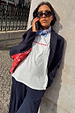 White Rodeo T-Shirt with red text, styled with a pinstripe suit and blue neck scarf for a London look.