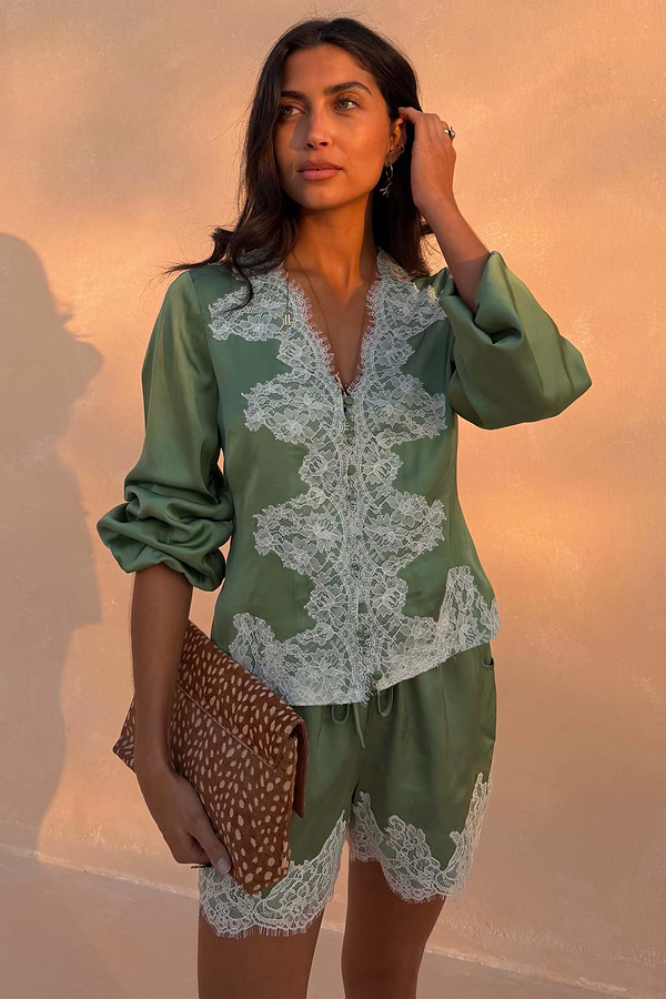 Green Lace Romi Top in soft green satin with contrast lace, button-up front and long voluminous sleeves.