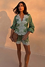 Green Lace Romi Top in soft green satin with white lace detailing and voluminous sleeves, designed in London.