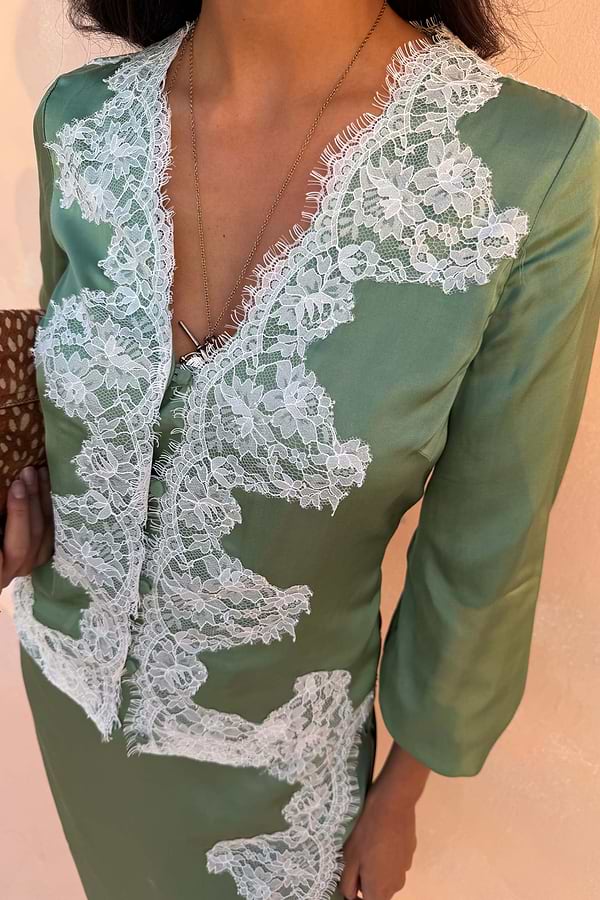 Green Lace Romi Top in soft green satin featuring contrast lace detailing and a button-down front.