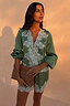 Green Lace Romi Top in green satin with contrast white lace panels and long sleeves with volume.