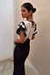 Mono Rose Betsy Midi Dress in a black and white rose print with frill sleeves and tie-neck detail.