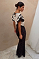 Mono Rose Betsy Midi Dress with monochrome floral panels, red roses and frill sleeves, styled on a model.