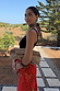 Red Rosie Maxi Skirt in a floral and leopard print, styled with a black tank top and patterned neck scarf.