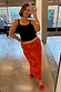 Rosie Maxi Skirt in a bold red floral and leopard print, featuring a bias cut and styled in a mirror selfie.