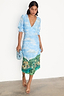 Thumbnail for Scenery May Dress Petite in blue Lake Como print with puff sleeves and a deep V-neckline, shown on a model.