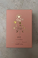 NFD Eau De Parfum 002 in a pink textured box with gold foil palm tree and celestial illustrations.