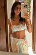 Blue Dreamer Shirred Bandeau Bikini Top with sun and palm motifs, styled with trousers in a mirror selfie.