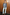 Thumbnail for Gunmetal Sequin Miley Shirt with blouson sleeves, styled with light blue jeans against a wooden wall.