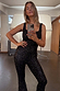 Black Sequin Jumpsuit with a square neckline and shimmering finish, captured in a studio mirror selfie.
