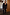 Thumbnail for Black Sequin Jumpsuit with a square neckline and flared trousers, styled with a blazer.