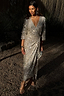Silver Sequin Kira Wrap Dress featuring a multi-wear wrap fastening and long sleeves, styled as a maxi party dress.