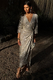 Silver Sequin Kira Wrap Dress with a shimmering finish and adjustable wrap tie fastening on a model.