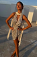 Silver Sequin Mini Jaspre Skirt and matching top styled with a cream lace scarf in the golden hour sun.