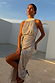 Silver Sequin Maxi Wrap Jaspre Skirt worn by a model against a white architectural backdrop.