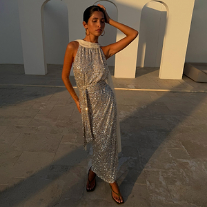 Silver Sequin Maxi Wrap Jaspre Skirt styled with a matching top outdoors at golden hour.