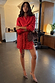 Red Sequin Mini Jaspre Skirt, a multi-wear wrap style paired with a red shirt and leopard heels.