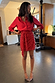 Red Sequin Mini Jaspre Skirt featuring a wrap tie waist, styled with a matching red shirt and leopard heels.