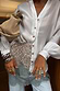 Thumbnail for Silver Sequin Mini Maeva Skirt with a grey lace trim, layered over jeans for a multi-wear London look.