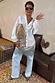 Silver Sequin Mini Maeva Skirt with a lace border layered over denim jeans for a multi-wear London look.